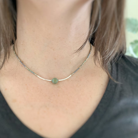 inspired by the ancients, this silver necklace has rustic green glass and twisted column beads