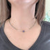 inspired by ancient columns, this purple iridescent necklace is an adjustable length choker style