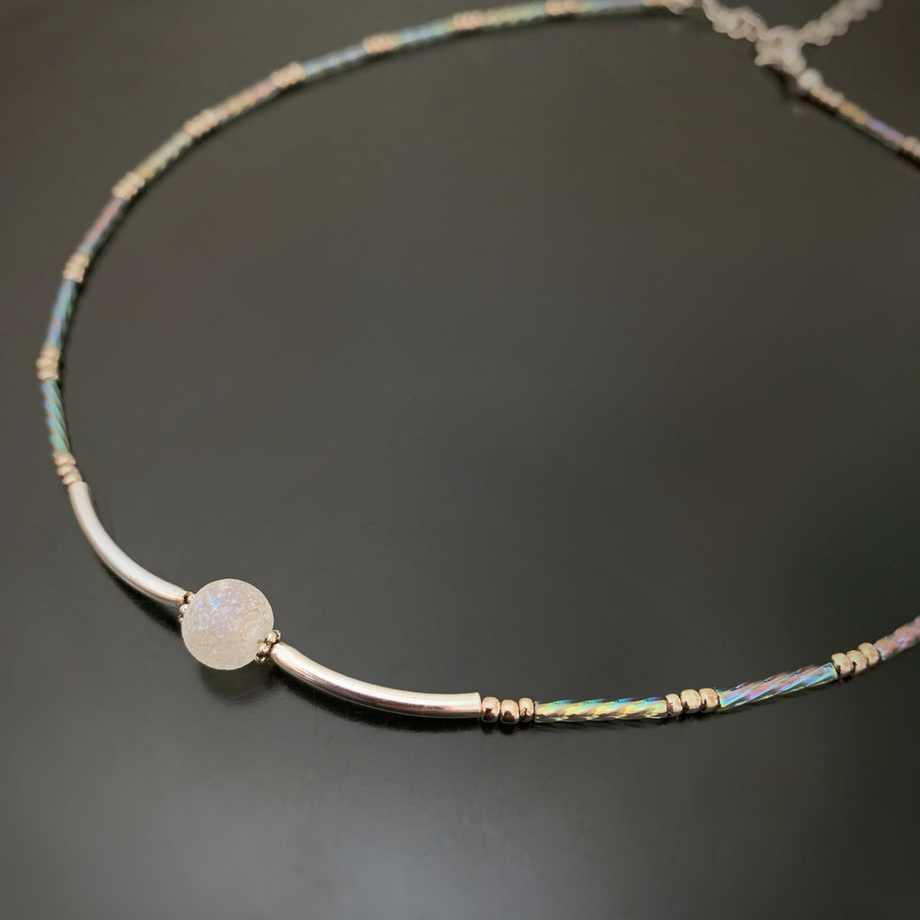 adjustable length choker necklace with silver accents, ancient looking white glass focal and twisted column glass beads