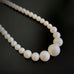 crystal pearl necklace with a matte finish and iridescent luster