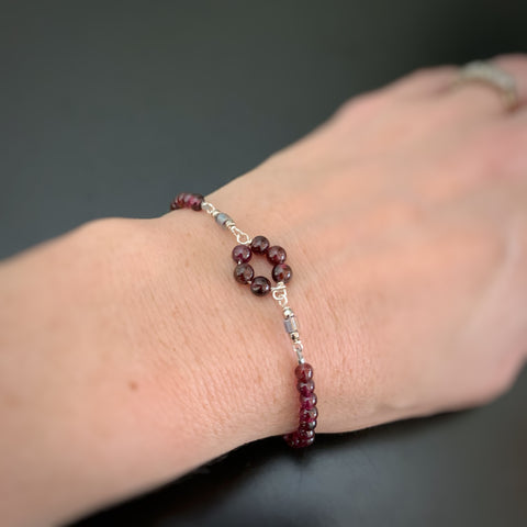 garnet bracelet with a circle of beads at the center