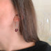 cluster of garnet beads and an accent of iridescent glass earrings in sterling silver ear wires 