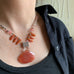 salmon pink teardrop necklace with fan dagger beads