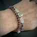 southwest style cross on two strand beaded bracelet with garnet, rose quartz and amethyst