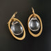 earrings with clear glass teardrop inside brass oval