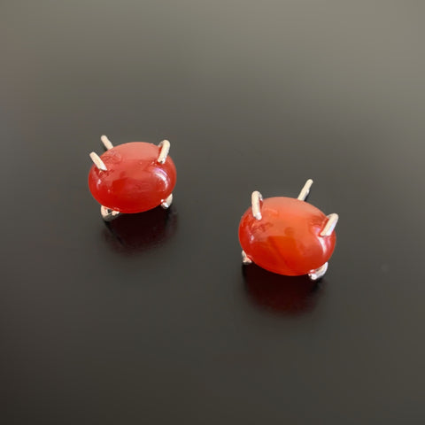 Carnelian red oval, sterling silver prong set post earrings.
