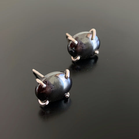 Hematite, metallic grey black oval, sterling silver prong set post earrings.