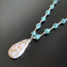 wire wrapped by hand this necklace has links of turquoise glass and white howlite