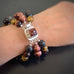 red, blue and brown tiger eye beads with freshwater pearls, a bracelet with an ornate box clasp