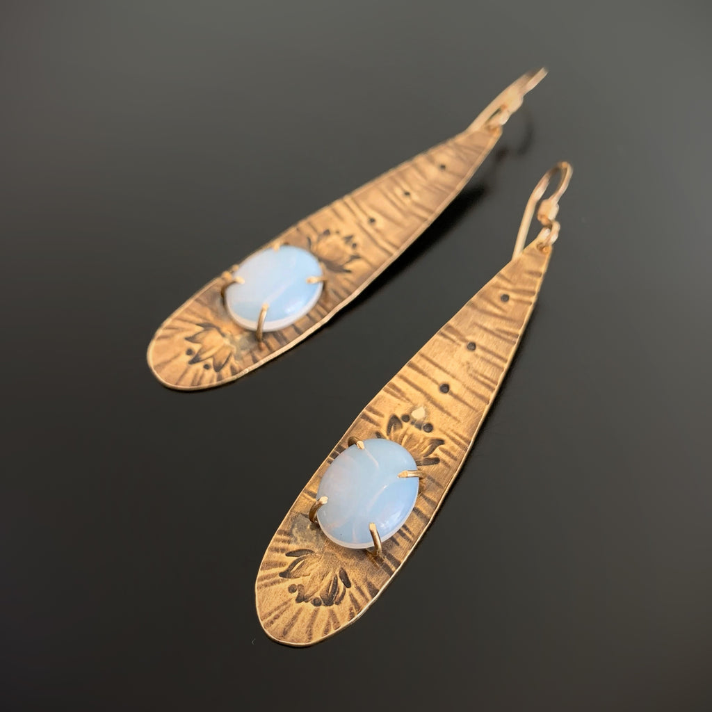 Long Golden Teardrop Earrings with Moon Glow Opal Glass and Lotus Flower Motif