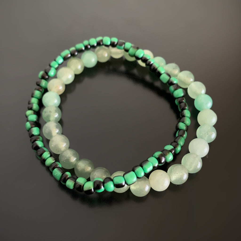 Pair of stretch bracelets, one in green aventurine, and one in green and black striped glass