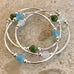 Trio of beachy glass bracelets in blues and greens