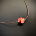 brown cord necklace with copper colored freshwater pearl focal