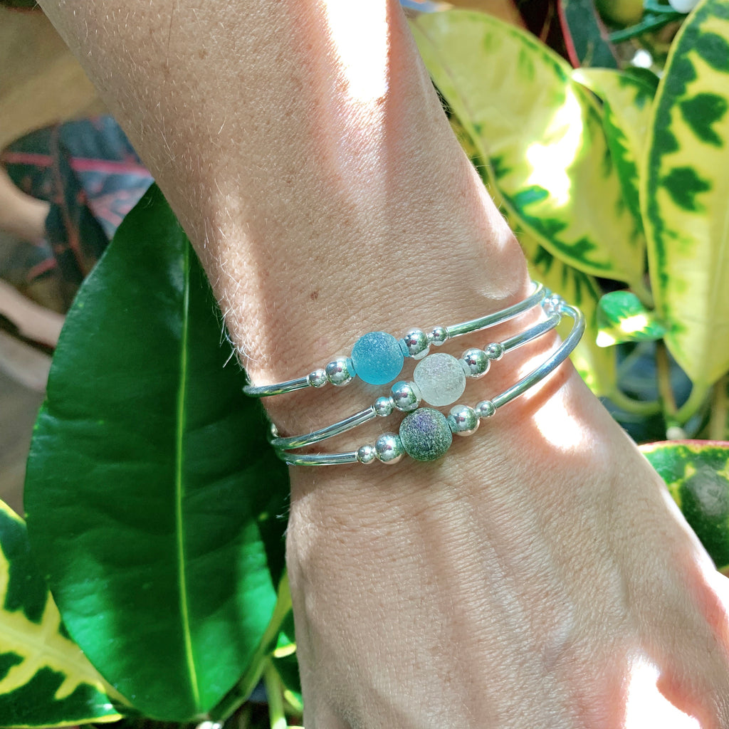 Trio of beachy glass bracelets in blues and greens