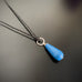 glass teardrop necklace with silver twisted loop in cadet blue option