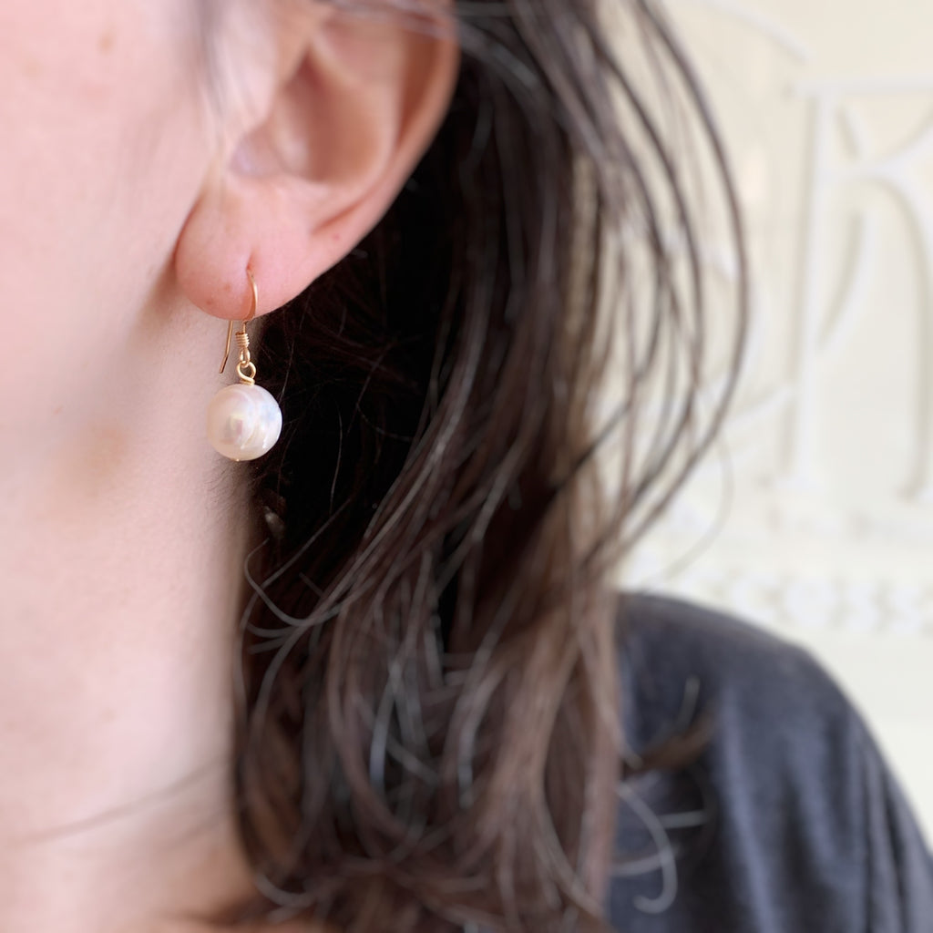 white pearl drop earrings in gold