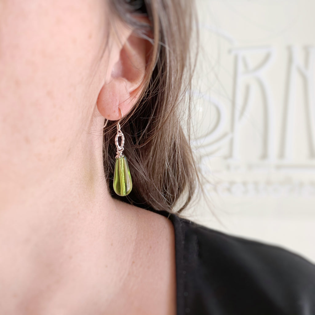 peridot green teardrop earrings with twisted ring accent