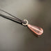 teardrop glass pendant with twisted silver loop, pink color option