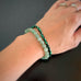 Set of two stretch bracelets, one in green aventurine, and one in green and black striped glass