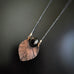 copper fan leaf necklace with black bead accent