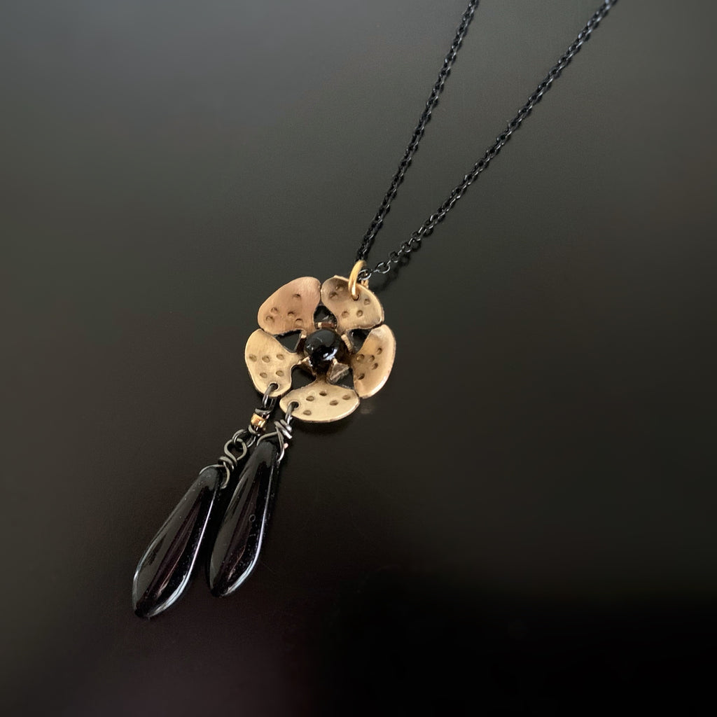 gold brass cherry blossom flower pendant with black teardrop dangle accents