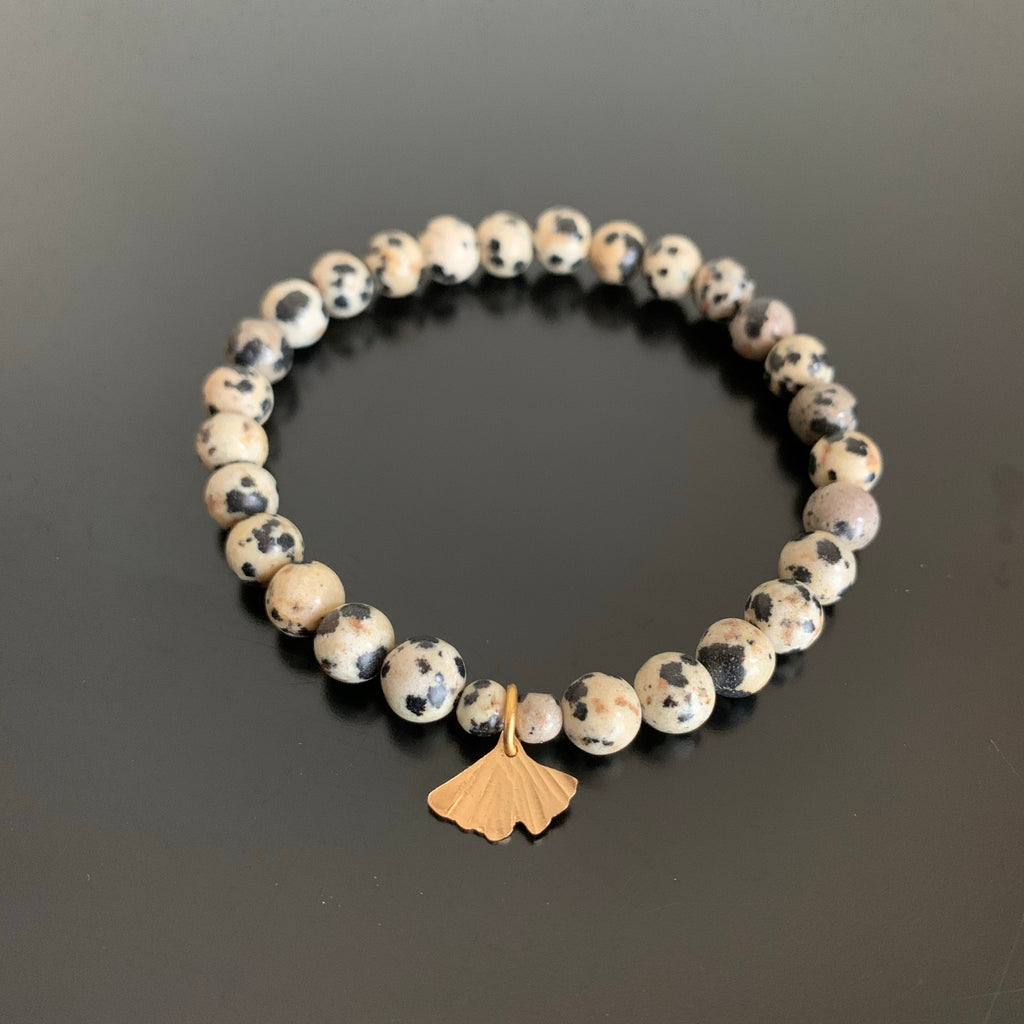 dalmatian jasper stretch bracelet with gold brass ginkgo charm