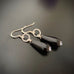 jet black teardrop earrings with twisted circle design and sterling silver ear wires
