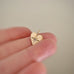 Light Hearted, pendant in 14k gold with white sapphire and cross on reverse NO CHAIN