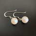 matte finish iridescent crystal pearl earrings with single drop