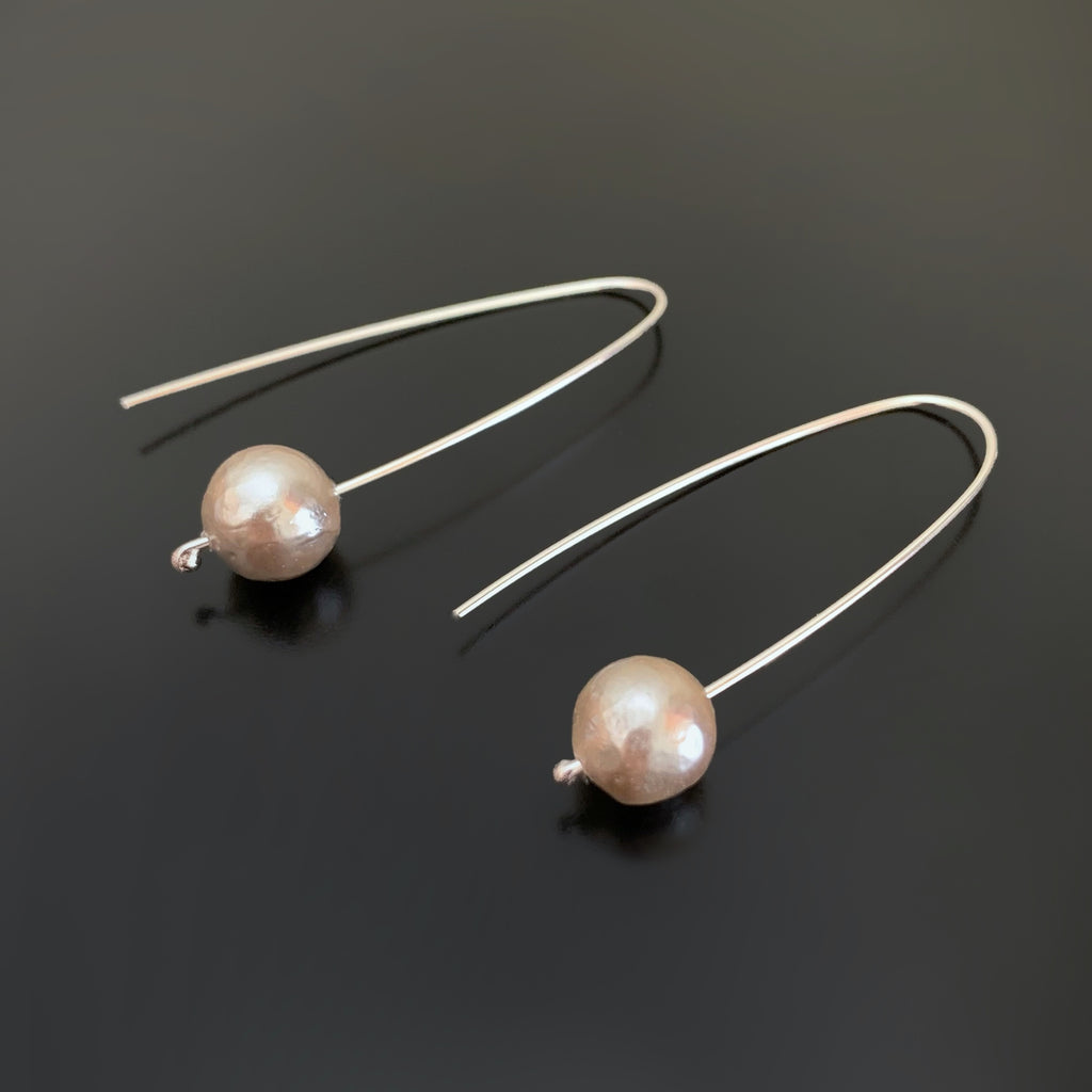 Pewter colored freshwater pearl earrings, free sliding on sterling silver pin ear wires.