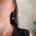 Pewter colored freshwater pearl, on sterling silver pin drop earrings, shown on model.