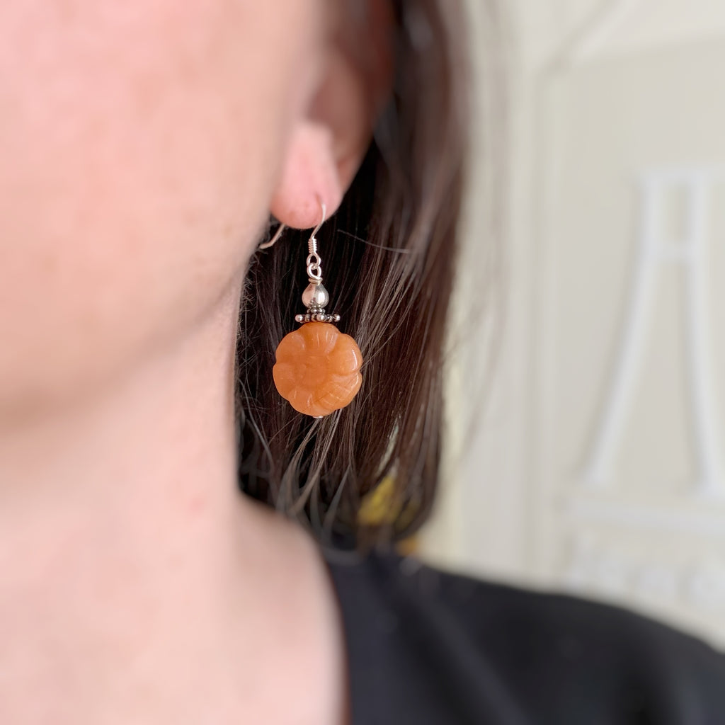 red aventurine carved flower dangle earrings with silvery accents