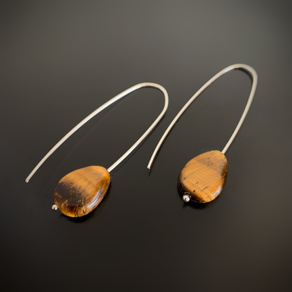 Tiger eye teardrops, free sliding on sterling silver pin drop ear wires.