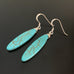 silver ear hooks with turquoise colored marquise drops