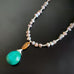 tiger eye and turquoise pendant on a warm freshwater pearl necklace
