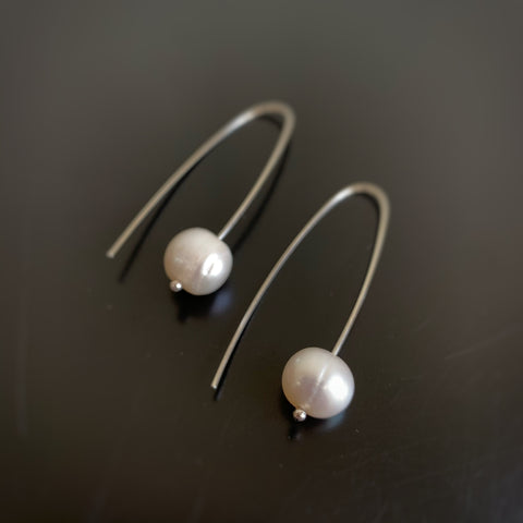 White freshwater pearl with sterling silver pin drop wire earrings.